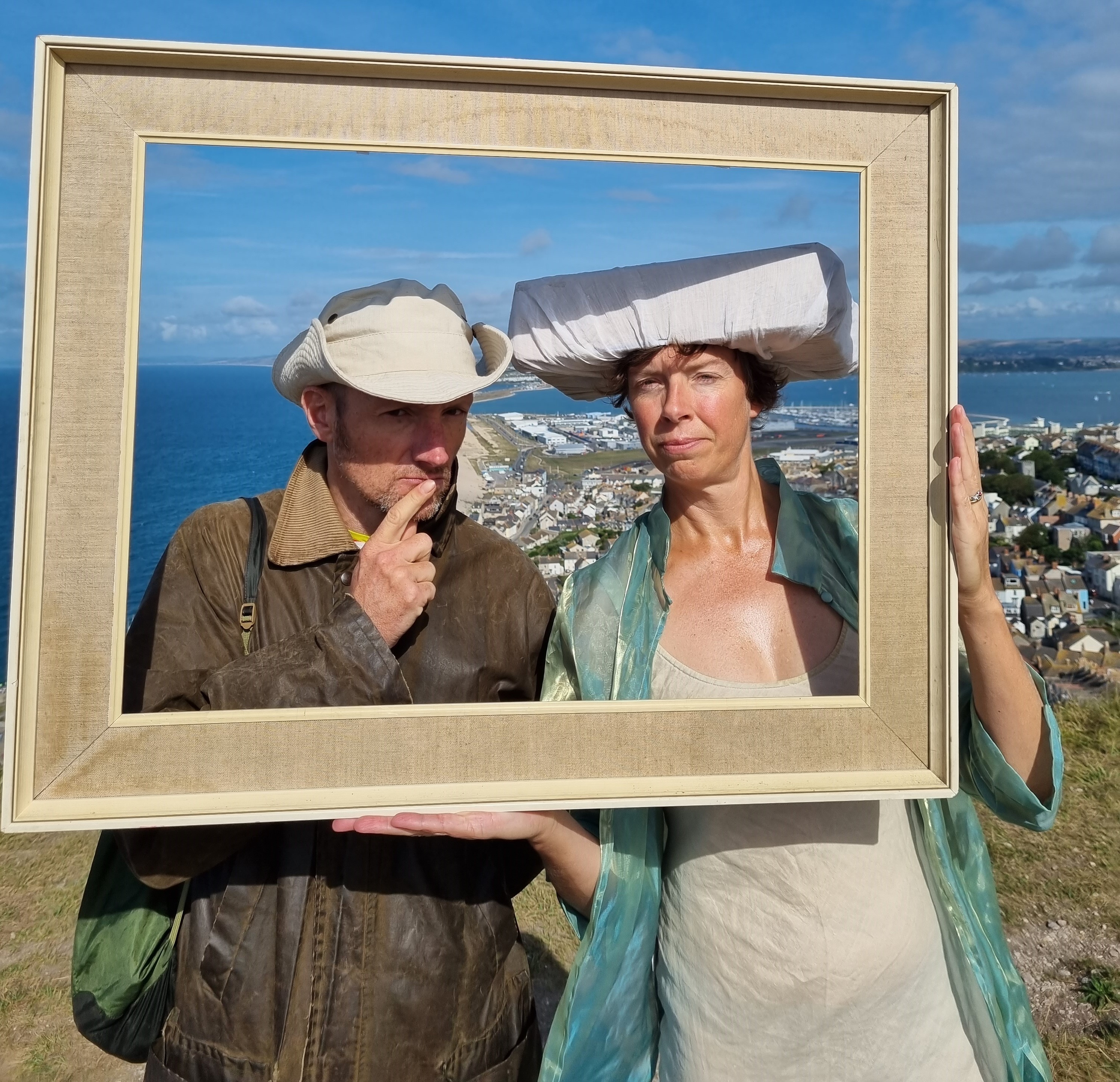 Simon and Jess with a frame and Chesil Beach
