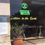 Letters to the Earth sign in shopfront